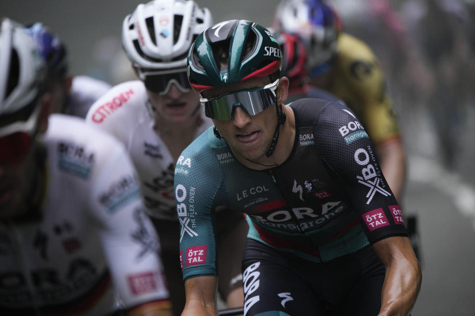 Stage winner and new overall leader Australia's Jai Hindley climbs in the breakaway group during the fifth stage of the Tour de France cycling race over 163 kilometers (101 miles) with start in Pau and finish in Laruns, France, Wednesday, July 5, 2023. (AP Photo/Daniel Cole)