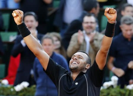 Jo-Wilfried Tsonga of France celebrates after defeating Kei Nishikori of Japan during their men's quarter-final match during the French Open tennis tournament at the Roland Garros stadium in Paris, France, June 2, 2015. REUTERS/Pascal Rossignol