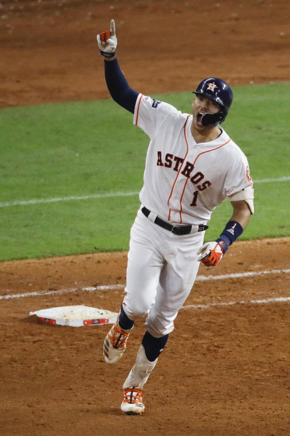 Houston Astros' Carlos Correa celebrates after his walk-off home run against the New York Yankees during the 11th inning in Game 2 of baseball's American League Championship Series Sunday, Oct. 13, 2019, in Houston. (AP Photo/Sue Ogrocki)