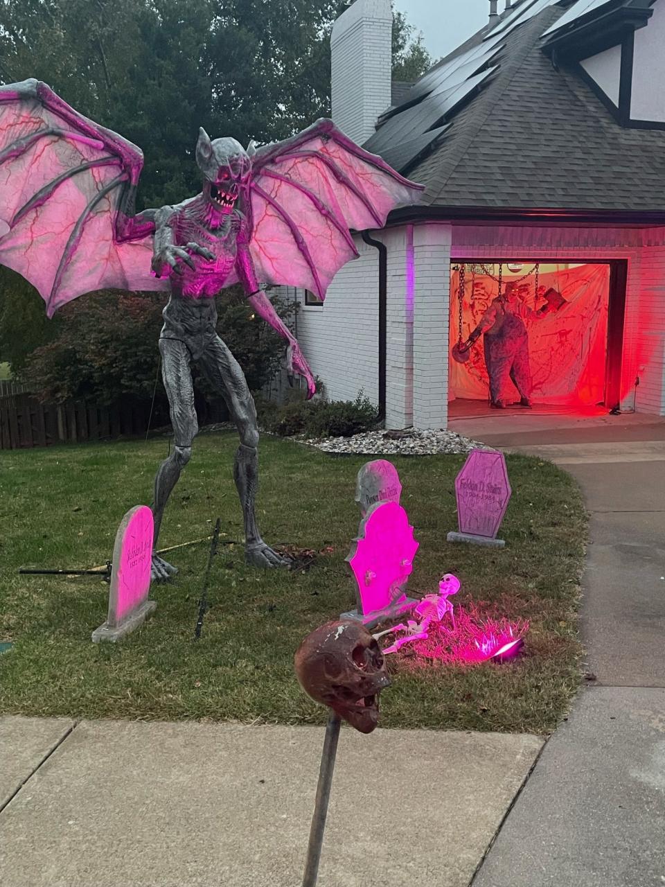 A large, winded demon-like creature stands in the front yard of 701 W. Bentwater Drive in Nixa.
