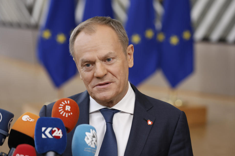 Poland's Prime Minister Donald Tusk talks to journalists as he arrives for an EU summit in Brussels, Thursday, Feb. 1, 2024. European Union leaders meet in Brussels for a one day summit to discuss the revision of the Multiannual Financial Framework 2021-2027, including support for Ukraine. (AP Photo/Omar Havana)