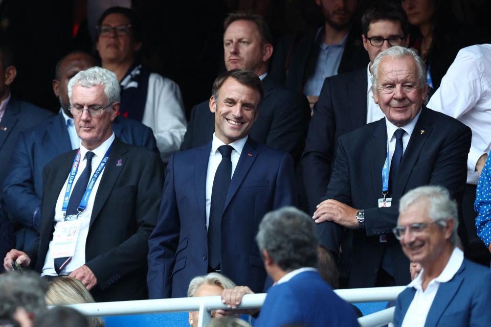 President Macron smiles from the stands (AFP via Getty Images)