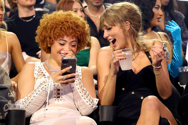 <p>Kevin Mazur/Getty </p> Ice Spice and Taylor Swift at the 2023 MTV VMAs