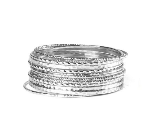 Clarie’s Silver Textured Bangle Bracelets (Set of 12), $7, Clarie’s. 