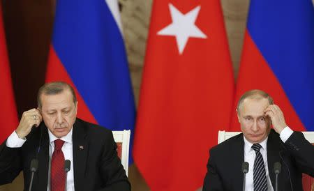 Russian President Vladimir Putin (R) and his Turkish counterpart Tayyip Erdogan attend a news conference after the talks at the Kremlin in Moscow, Russia, March 10, 2017. REUTERS/Sergei Ilnitsky/Pool