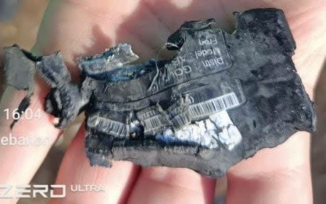 A ruined pager with the marker 'Gold Apollo', a Taiwanese company that denies making the batch bought by Hezbollah