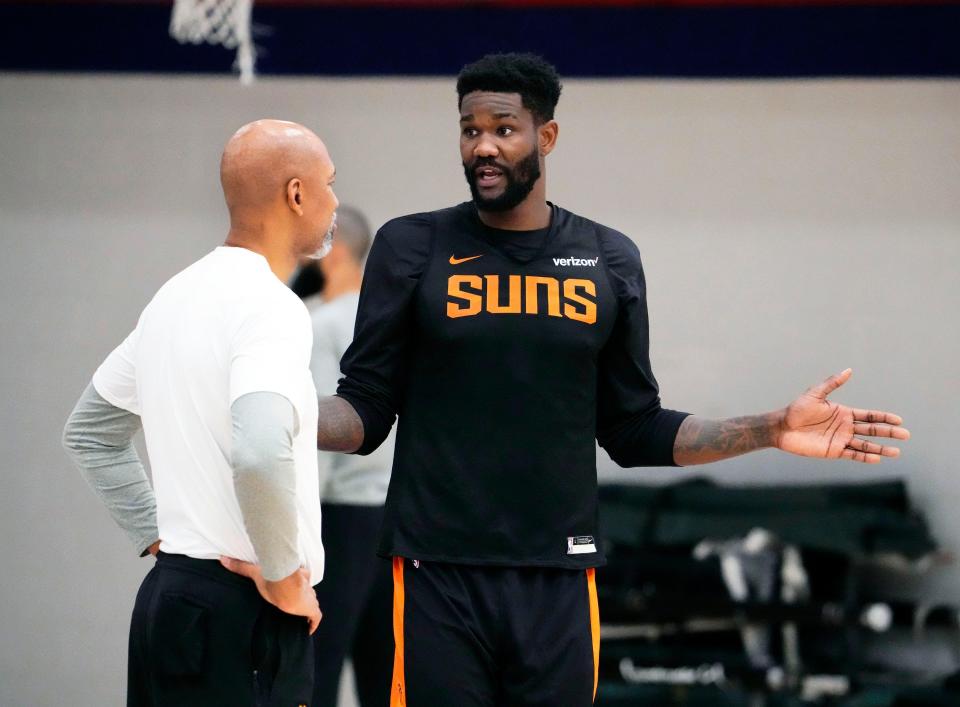 Phoenix Suns head coach Monty Williams (front left) listens to center Deandre Ayton during practice on April 30, 2023, at Auraria Event Center in Denver, Colo., as the team prepares for Game 2 of the Western Conference Semifinals.