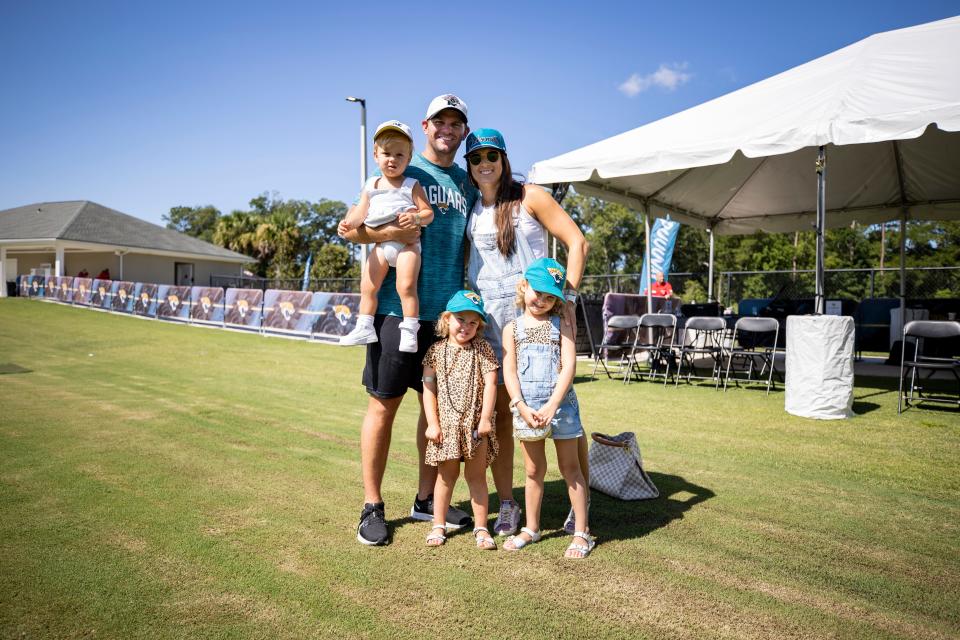 Jaguars offensive coordinator Press Taylor, holding son Woods, with his wife Brooklyn and daughters Teale and Carolina Leigh at the team's 2022 training camp. The Taylor family added son Billy on March 10.