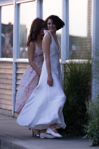 <p>WavyPeter / SplashNews.com</p> Margaret Qualley arrives at her wedding party, dressed in a white gown.