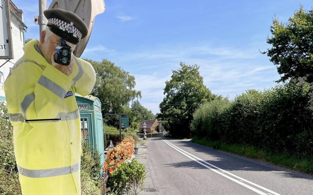 The use of a cardboard cut-out of a police officer, known as Bob, is aimed at encouraging slower and safer driving - SWNS