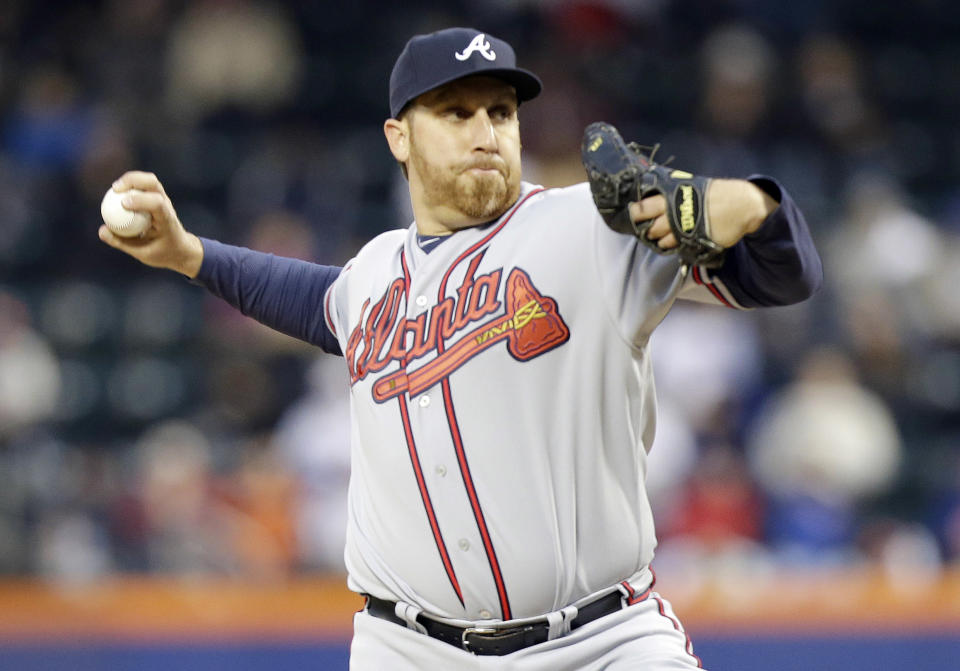 Atlanta Braves' Aaron Harang delivers a pitch during the first inning of a baseball game against the New York Mets, Friday, April 18, 2014, in New York. (AP Photo/Frank Franklin II)