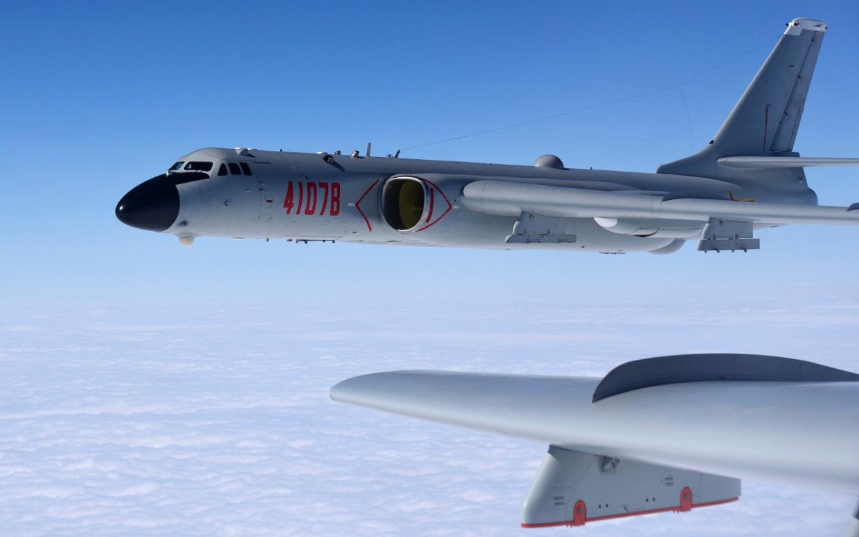 Chinese H-6 heavy bombers conduct a patrol over the ocean. Such aircraft could launch WZ-8 supersonic/hypersonic drones in an attempt to locate US aircraft carriers for targeting by long-range missiles