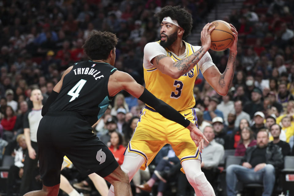 PORTLAND, OREGON – FEBRUARY 13: Anthony Davis #3 of the Los Angeles Lakers looks to pass as <a class="link " href="https://sports.yahoo.com/nba/players/6208" data-i13n="sec:content-canvas;subsec:anchor_text;elm:context_link" data-ylk="slk:Matisse Thybulle;sec:content-canvas;subsec:anchor_text;elm:context_link;itc:0">Matisse Thybulle</a> #4 of the <a class="link " href="https://sports.yahoo.com/nba/teams/portland/" data-i13n="sec:content-canvas;subsec:anchor_text;elm:context_link" data-ylk="slk:Portland Trail Blazers;sec:content-canvas;subsec:anchor_text;elm:context_link;itc:0">Portland Trail Blazers</a> defends during the third quarter at Moda Center on February 13, 2023 in Portland, Oregon. NOTE TO USER: User expressly acknowledges and agrees that, by downloading and or using this photograph, user is consenting to the terms and conditions of the Getty Images License Agreement. (Photo by Amanda Loman/Getty Images)