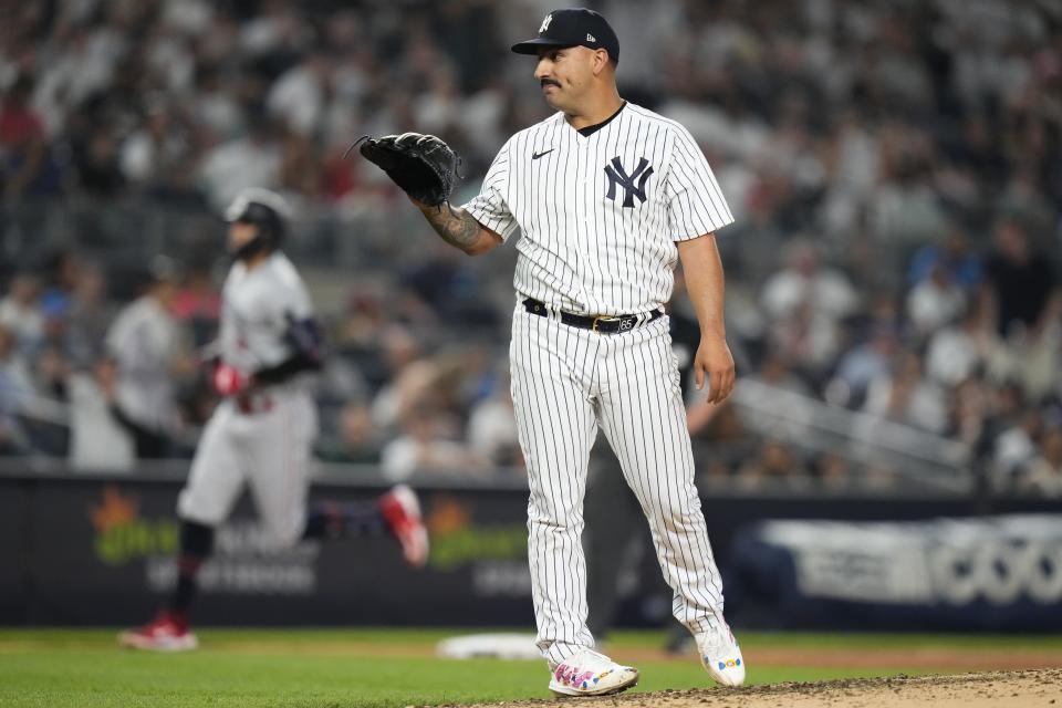 New York Yankees starting pitcher Nestor Cortes waits for a new ball as Minnesota Twins' Carlos Correa runs the bases on a home run during the sixth inning of a baseball game Friday, April 14, 2023, in New York. (AP Photo/Frank Franklin II)