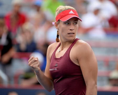 Jul 29, 2016; Montreal, Quebec, Canada; Angelique Kerber of Germany reacts after defeating Daria Kasatkina of Russia (not pictured) on day five of the Rogers Cup tennis tournament at Uniprix Stadium. Mandatory Credit: Eric Bolte-USA TODAY Sports