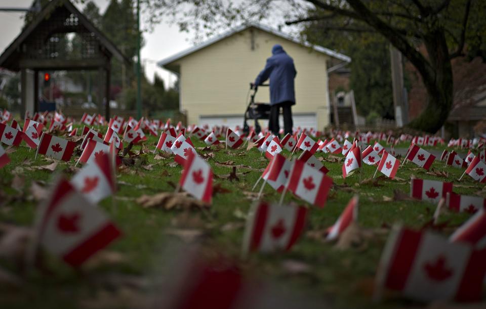 Canadian flags in honour of Remembrance Day cover the property of a seniors home in Burnaby