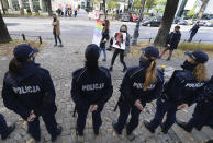 Pro-choice activists from "Women Strike" attend a protest in front of Poland's constitutional court, in Warsaw, Poland, Thursday, Oct. 22, 2020. Poland’s top court has ruled that a law allowing abortion of fetuses with congenital defects is unconstitutional. The decision by the country’s Constitutional Court effectively bans terminating pregnancies in cases where birth defects are found and will further limit access to abortions in Poland. (AP Photo/Czarek Sokolowski)