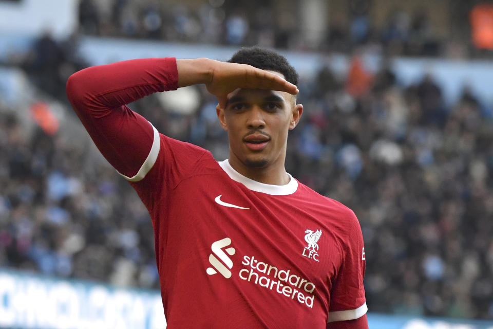 Liverpool's Trent Alexander-Arnold celebrates after scoring his side's opening goal during the English Premier League soccer match between Manchester City and Liverpool at Etihad stadium in Manchester, England, Saturday, Nov. 25, 2023. (AP Photo/Rui Vieira)