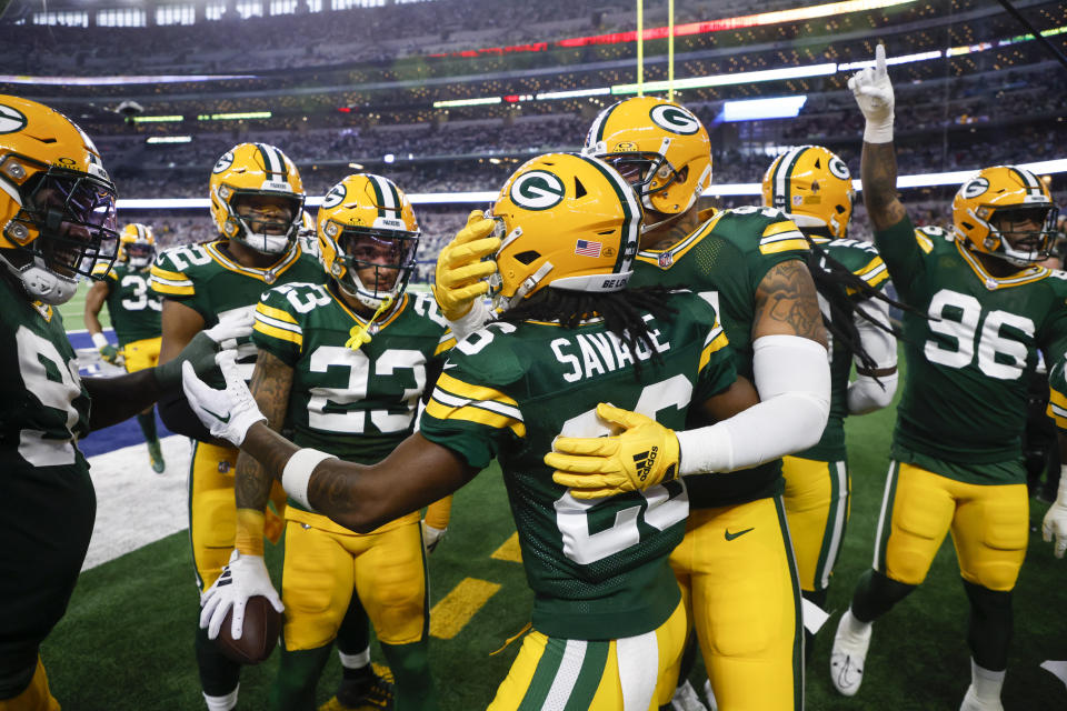 Green Bay Packers safety Darnell Savage (26) reacts with teammates after scoring on an interception return on a pass by Dallas Cowboys quarterback Dak Prescott during the first half of an NFL football game, Sunday, Jan. 14, 2024, in Arlington, Texas. (AP Photo/Michael Ainsworth)