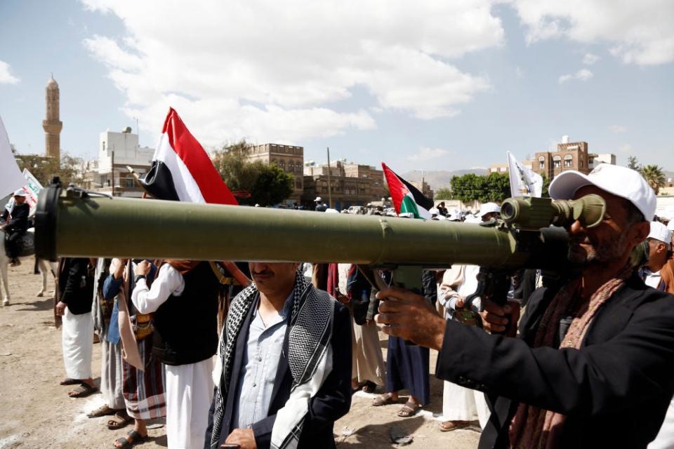 SANA'A, YEMEN - FEBRUARY 29: Yemen's Houthi followers carry weapons while taking part in a parade staged in solidarity with Palestinians and against Israel's war on the people of the Gaza Strip and other Palestinian territories, on February 29, 2024, in Sana'a, Yemen. Yemen's Houthi movement vowed to retaliate against Israel and its allies by sustaining its maritime attacks until Israel stops the war on Palestinians. (Photo by Mohammed Hamoud/Getty Images)