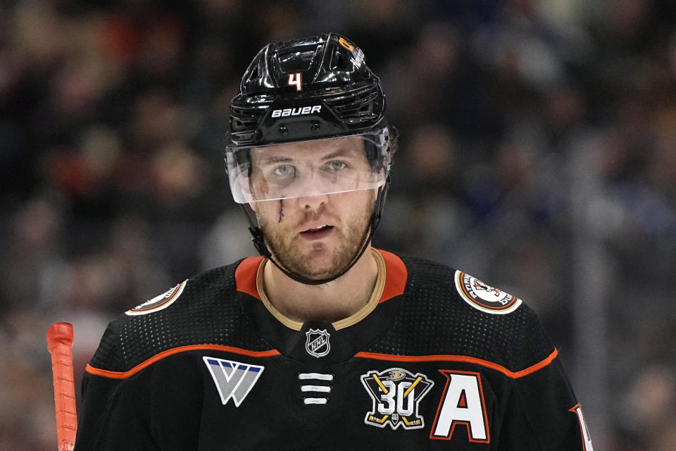 Anaheim Ducks defenseman Cam Fowler stands on the ice during the third period of an NHL hockey game against the Vancouver Canucks Sunday, March 3, 2024, in Anaheim, Calif. Fowler was hit in the face by a puck on Feb. 29. (AP Photo/Mark J. Terrill)