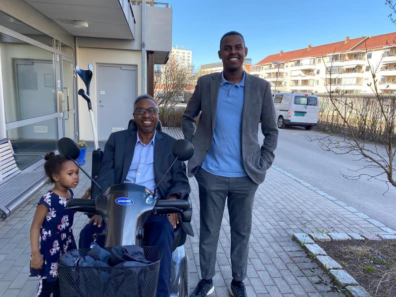 Sadad Dakhare poses with his father Mohamed Dakhare Farah and niece Safa Mohamed Hassan