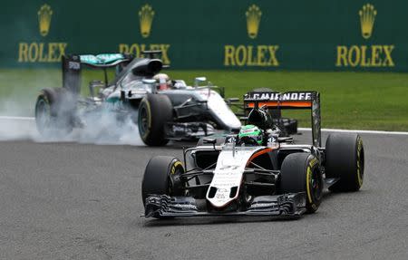 Belgium Formula One - F1 - Belgian Grand Prix 2016 - Francorchamps, Belgium - 28/8/16 - Force India's Nico Hulkenberg of Germany leads the race ahead of Mercedes' Lewis Hamilton of Britain during the Belgian F1 Grand Prix. REUTERS/Yves Herman