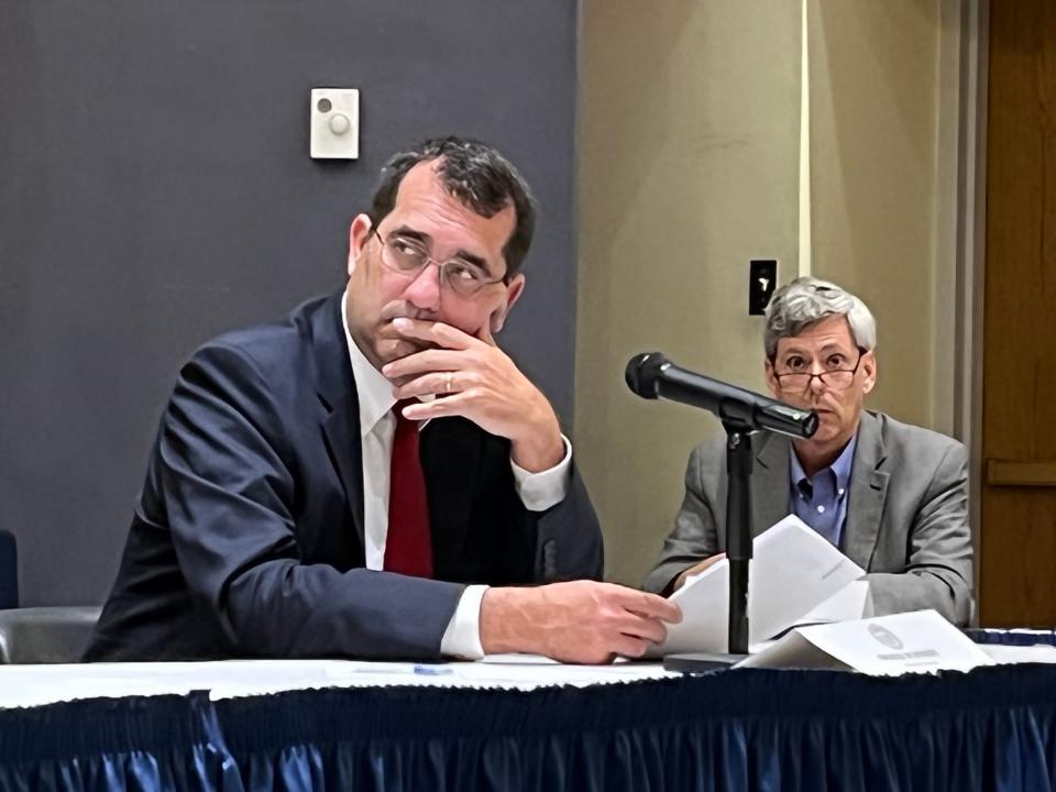 Attorney General Derek Schmidt listens to discussion before the primary election results were certified.