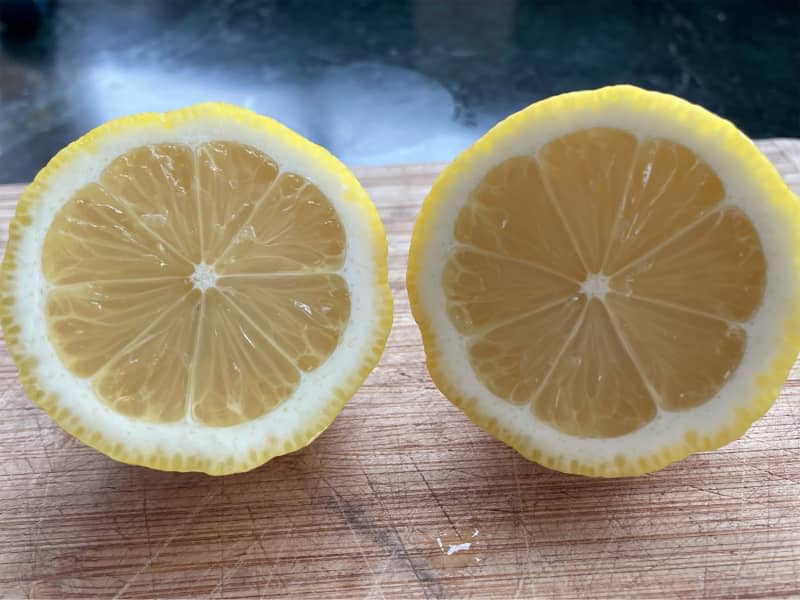 Seedless lemons sliced in half.