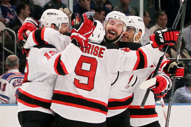 NEW YORK, NY - MAY 23: Zach Parise #9, Travis Zajac #19, Ilya Kovalchuk #17 and Bryce Salvador #24 of the New Jersey Devils celebrate their 5 to3 win over the New York Rangers in Game Five of the Eastern Conference Final during the 2012 NHL Stanley Cup Playoffs at Madison Square Garden on May 23, 2012 in New York City. (Photo by Bruce Bennett/Getty Images)