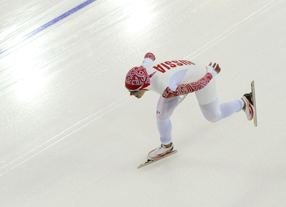 Russia's Olga Graf competes in the women's 3,000-meter speedskating race at the Adler Arena Skating Center during the 2014 Winter Olympics, Sunday, Feb. 9, 2014, in Sochi, Russia. (AP Photo/Antonin Thuillier, Pool)