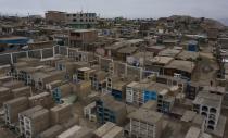 Tombs fill the Cristo el Salvador cemetery at Villa el Salvador on the outskirts of Lima, Peru, amid the COVID-19 pandemic, Tuesday, June 30, 2020. (AP Photo/Rodrigo Abd)