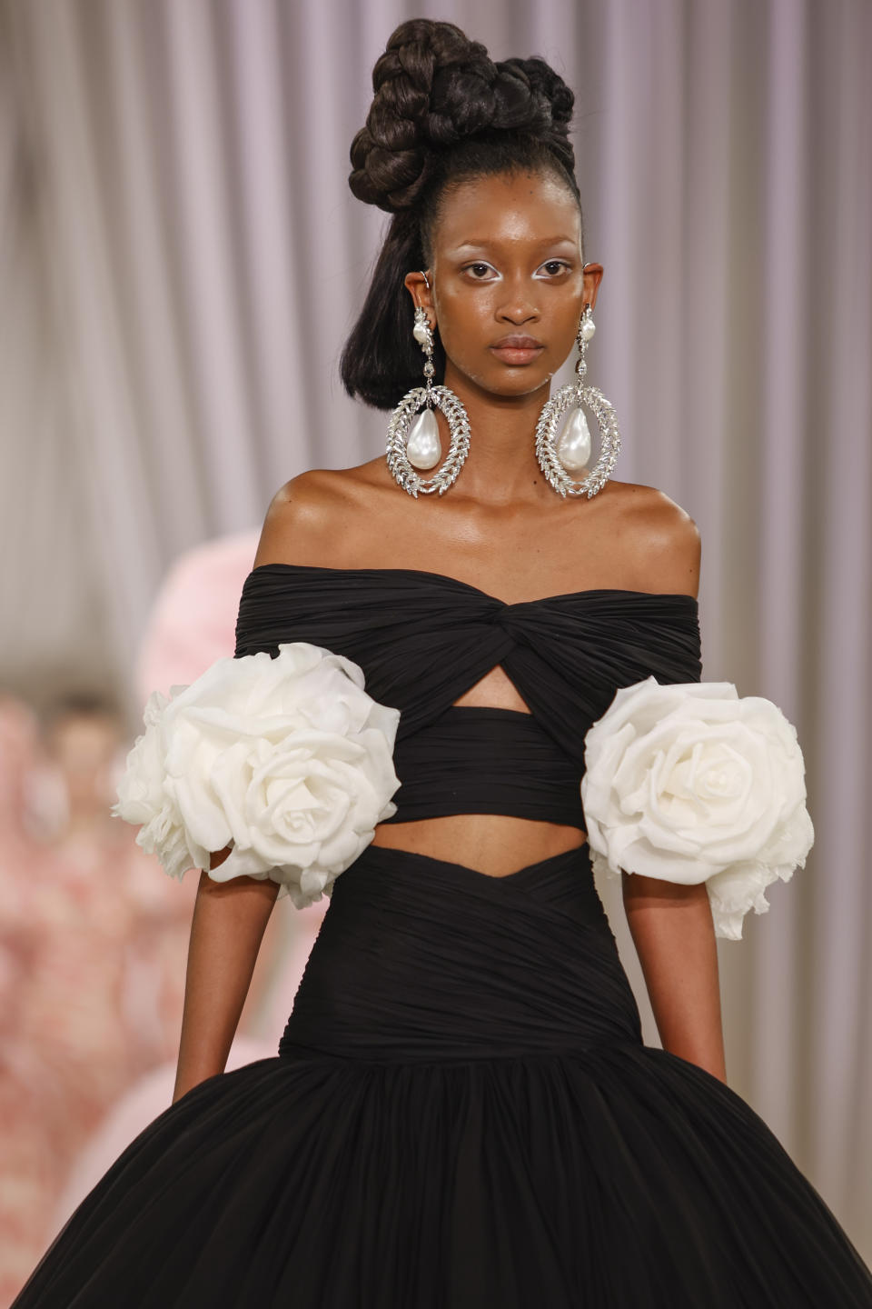 A model wears a creation as part of the Giambattista Valli Haute Couture Spring-Summer 2023 collection presented in Paris, Monday, Jan. 23, 2023. (AP Photo/Lewis Joly)