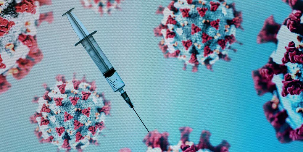 topshot a syringe is pictured on an illustration representation of covid 19, the disease caused by the novel coronavirus in paris on may 18, 2020 photo by joel saget afp photo by joel sagetafp via getty images