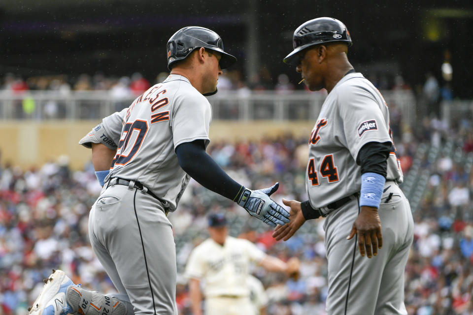 Detroit Tigers first baseman Spencer Torkelson, left, celebrates with third base coach Gary Jones after hitting a two-run home run against the Minnesota Twins during the fifth inning of a baseball game, Sunday, June 18, 2023, in Minneapolis. (AP Photo/Craig Lassig)