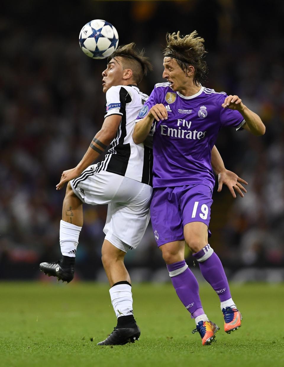 <p>Real Madrid’s Luka Modric, right, challenges for the ball with Juventus’ Paulo Dybala during the Champions League final soccer match between Juventus and Real Madrid at the Millennium Stadium in Cardiff, Wales, Saturday June 3, 2017. (AP Photo/Tim Ireland) </p>