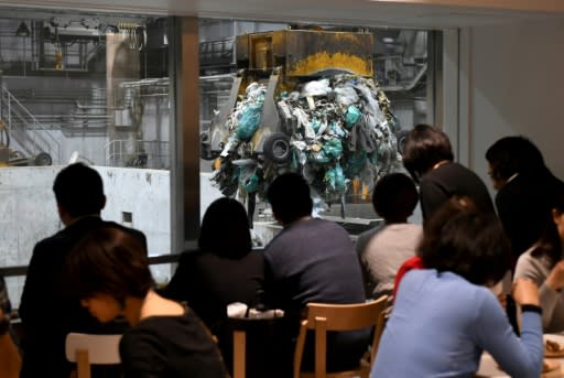 The facility is designed to be attractive, with wooden slats along the facade to mask the concrete shell, and windows at eye level to invite curiosity