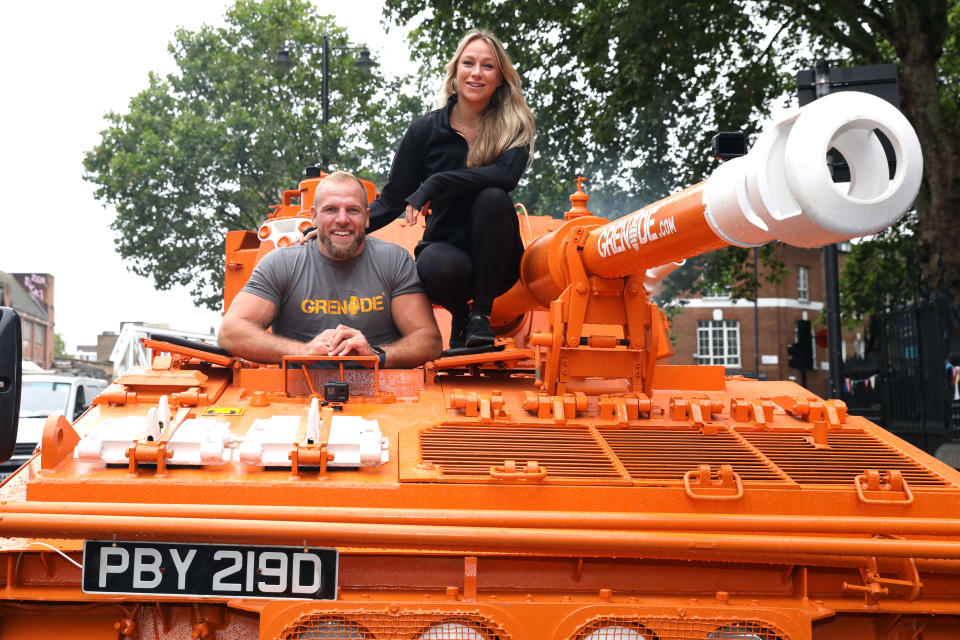 LONDON, ENGLAND - AUGUST 05: James Haskell and Chloe Madeley jump on board the Grenade® tank on August 05, 2019 in London, England. (Photo by Lia Toby/Getty Images for Grenade)