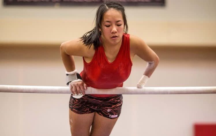 Amelia "Millie" Andrilenas is Kirkland (Wash.) Juanita High's top gymnast despite only having one hand -- Dean Rutz/The Seattle Times