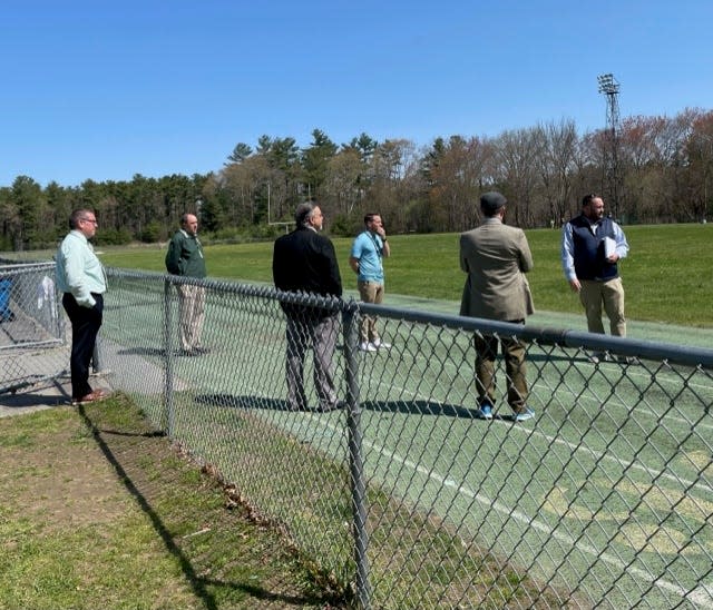 From left, Assistant Superintendent Adam Blaisdell, teacher/track coach Benjamin Pease, Superintendent Anthony Azar, teacher/track coach Brendan DeLano,  Business Administrator Robert Baxter and Kristoff Eldridge of Cape and Island Tennis &amp; Track, discuss plans for a new track at Dighton-Rehoboth Regional High School.