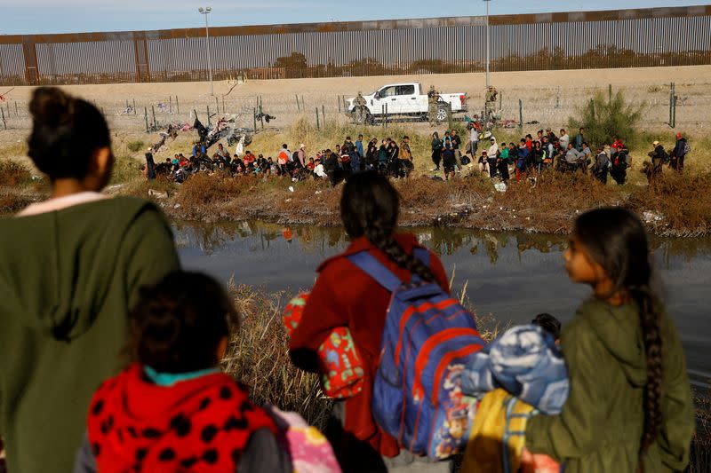 FILE PHOTO: Migrants seeking asylum in the United States gather on the banks of the Rio Bravo river, in Ciudad Juarez