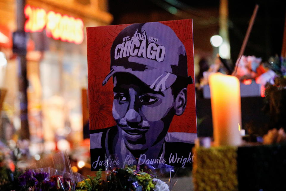 A poster of Daunte Wright is seen placed near a candle on the sidewalk after the guilty verdict in the Derek Chauvin trial was announced at George Floyd Square in Minneapolis on April 20. 