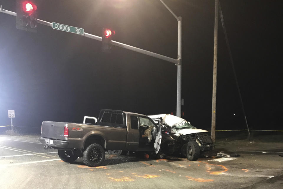 FILE - In this Nov. 29, 2019 file photo provided by the Marion County Sheriff's Office, the scene of a deadly van crash in Salem, Ore. is shown. Three Christmas tree farm workers from Guatemala were killed in the crash, which immigrant and worker advocates says helped shed light on "invisible work" by immigrant workers that takes place in Oregon, which has the U.S.'s largest Christmas tree industry. (Marion County Sheriff's Office via AP, File)