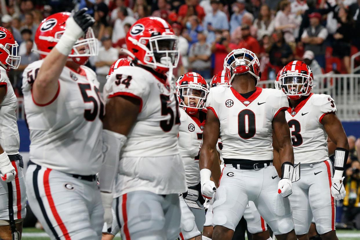 Georgia tight end Darnell Washington (0) celebrates after scoring his first career touchdown during the first half of the Southeastern Conference championship NCAA college football game between Georgia and Alabama in Atlanta, on Saturday, Dec. 4, 2021. 