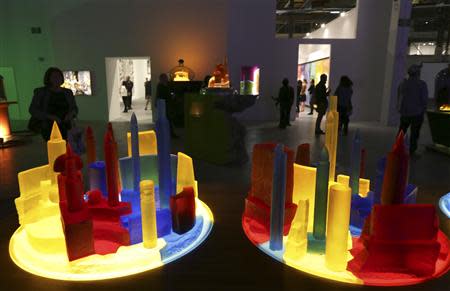 People view art pieces based on the bottle city of Kandor during an exhibition of work by the late artist Mike Kelley during a media preview at The Geffen Contemporary at The Museum of Contemporary Art (MOCA) in Los Angeles, California March 28, 2014. REUTERS/Jonathan Alcorn