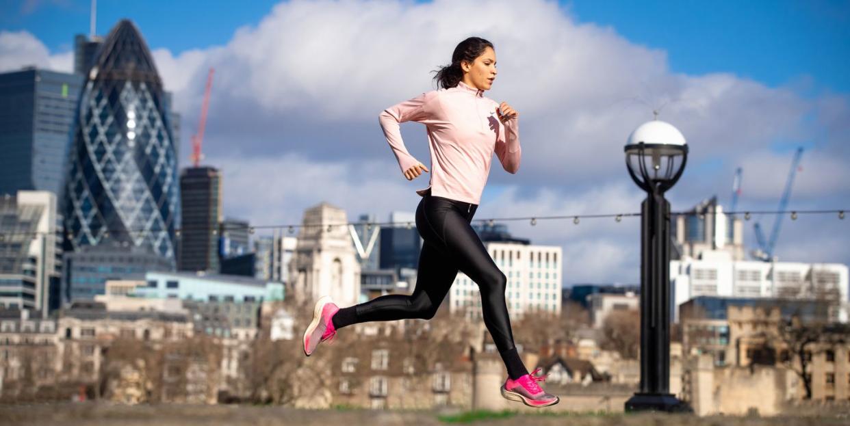 young woman jogging in the city of london