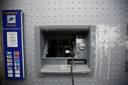 A vandalized automatic bank teller is seen the day after clashes during a national day of protest by the "yellow vests" movement in Bordeaux, France, December 9, 2018. REUTERS/Regis Duvignau