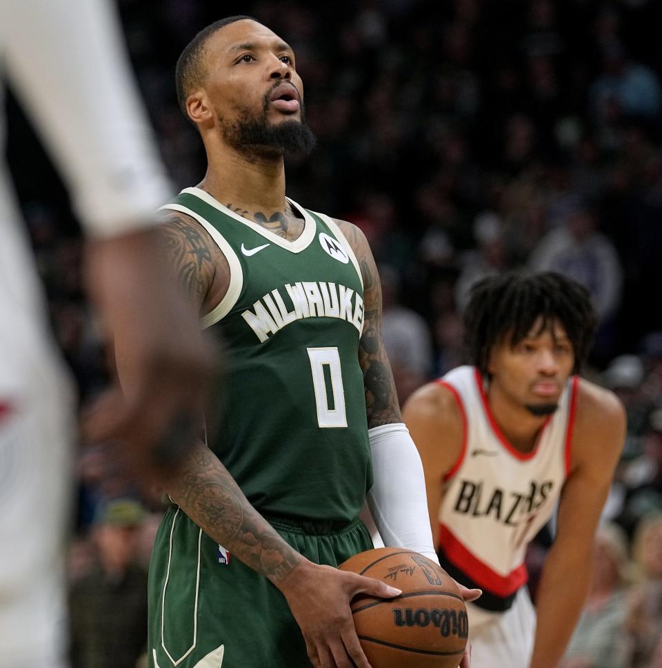 Milwaukee Bucks guard Damian Lillard (0) takes a deep breath before hitting a pair of free throws late in the second half of their game Sunday, November 26, 2023 at Fiserv Forum in Milwaukee, Wisconsin. The Milwaukee Bucks beat the Portland Trailblazers 108-102.