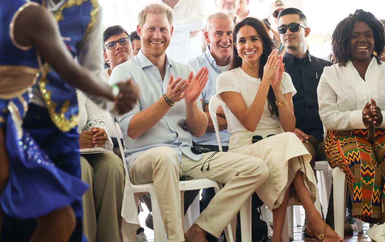 All smiles as couple watch salsa and hip hop at a recreational centre in Cali