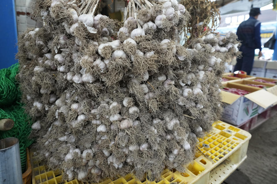 Bulbs of garlic are displayed at a shop in a traditional market in Seoul, South Korea, Wednesday, Aug. 3, 2022. A rural South Korean town is hot water over its video ad on garlic that some farmers say is obscene and has even sexually objectified the agricultural product. (AP Photo/Ahn Young-joon)